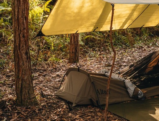 Where is the best place to set up a tarp shelter?